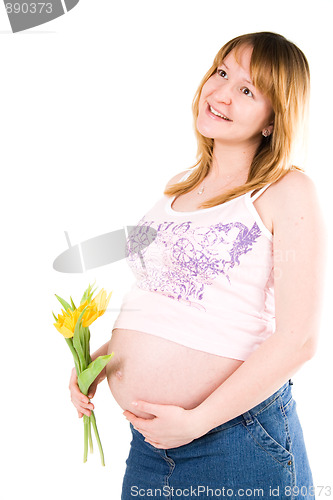 Image of pregnant woman with yellow tulips 