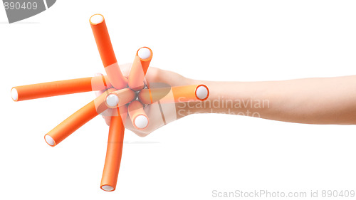 Image of Hand with bunch of curlers