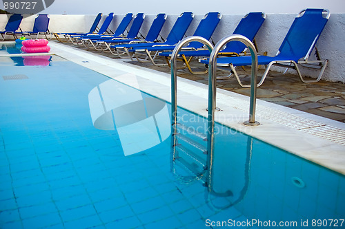 Image of Row of blue deck-chairs