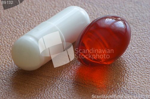 Image of Red gelatine pill and capsule