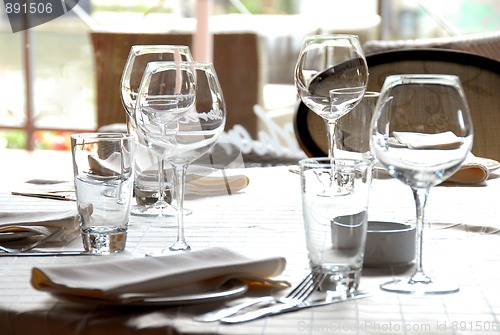 Image of Glasses served on table in restaurant