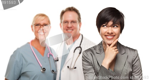 Image of Young Multiethnic Woman and Doctors