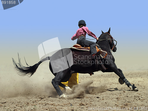 Image of Cowgirl Rounding a Drum in the Barrel Race 