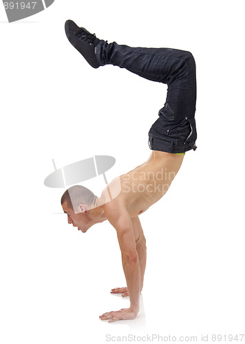 Image of Young bboy standing on hands