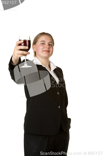 Image of young business woman toasting with glass of wine 