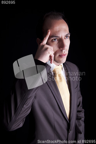 Image of Portrait of a young business man thinking