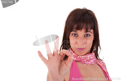 Image of Young pretty women with thumb ok as a sign of success