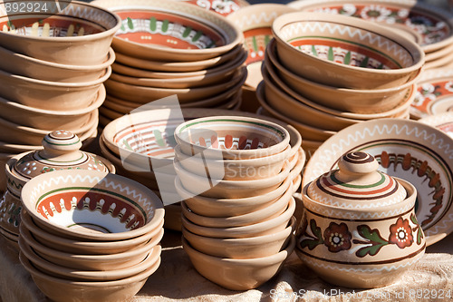 Image of Stack of decorated handmade ceramic ware at the handicraft market