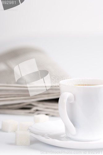 Image of coffee, sugar and newspapers