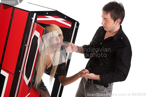 Image of Magician performance with beauty girls in a magic box
