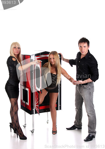 Image of Magician performance with beauty girls in a magic box