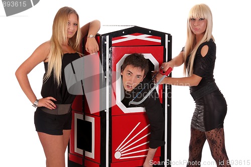 Image of Magician performance and two beauty girls in a magic box with ha
