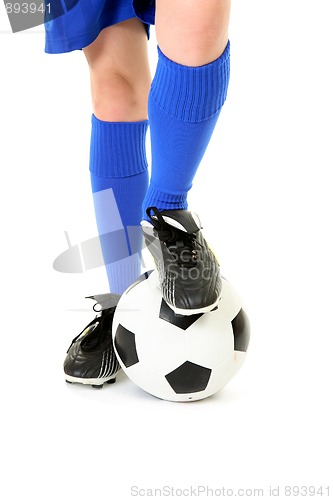 Image of Boy with foot on soccer ball
