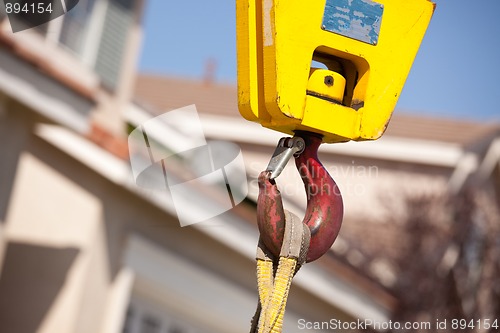 Image of Yellow Crane Head with Red Hook