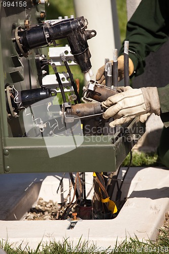 Image of Utility Workers Installing New Electrical Equipment