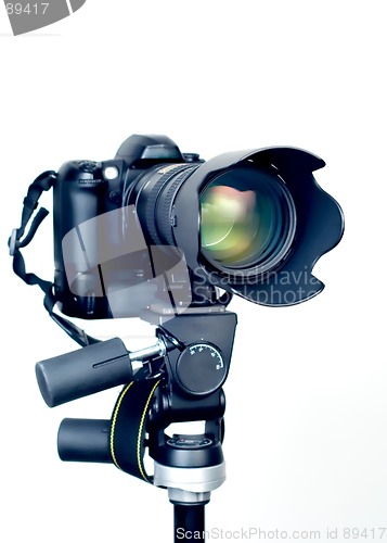 Image of Professional digital SLR camera with telephoto zoom lens on tripod. Isolated white background 3