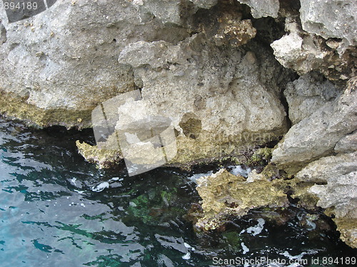 Image of Rocks into the water