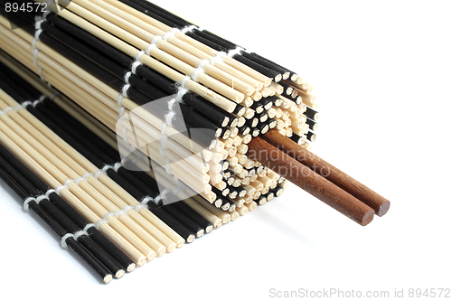Image of Rolled bamboo mat with chopsticks