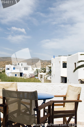 Image of Greek island Ios hotel patio with view of classic architecture