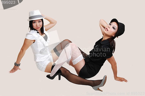 Image of Two Chinese girls with hat.