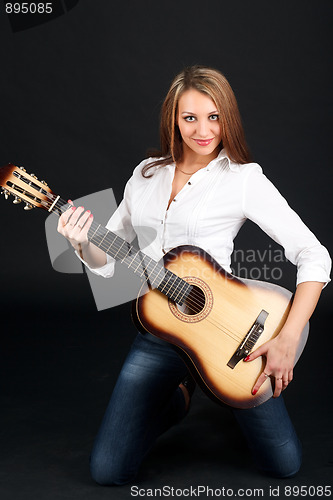 Image of Woman with guitar.