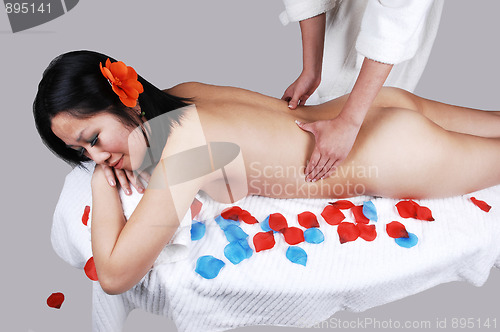 Image of A nude Chinese girl getting massage.