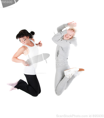 Image of Two jumping fitness instructors isolated on white 