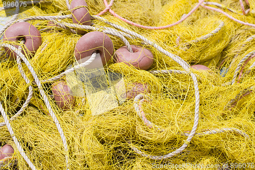 Image of Tangled fishing tackle: net, float, rope close-up