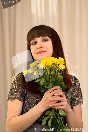 Image of Smiling woman with flowers