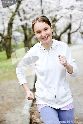 Image of Girl jogging in park