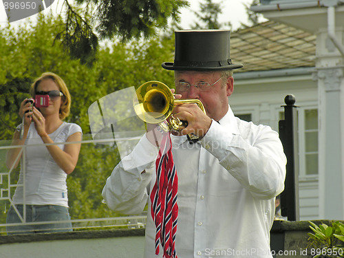 Image of Girl filming a Musician in Stockholm