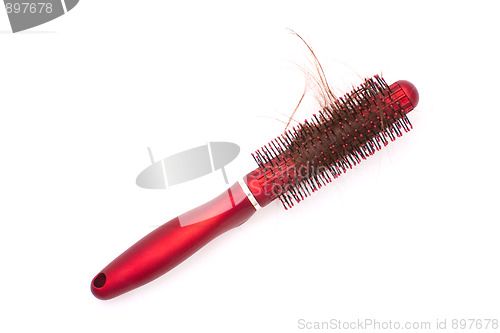 Image of Hairbrush with tangled hair