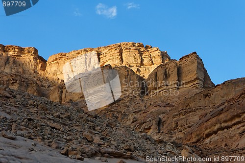 Image of Golden rock in the desert at sunset 