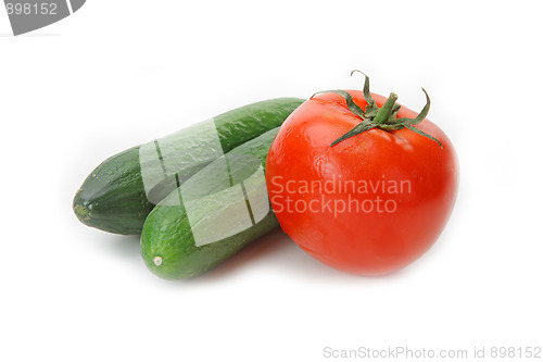 Image of Tasty kitchen. Fresh vegetables isolated on white