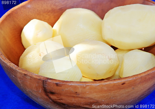 Image of Tasty kitchen. Potato in the wooden salad-dish
