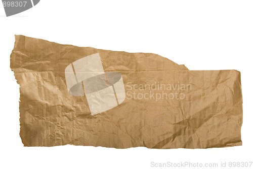 Image of Piece of brown paper, torn on white