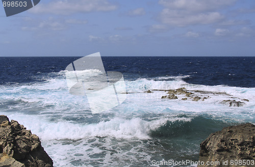 Image of Stormy waves on rocky beach