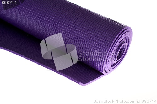 Image of rolled yoga mat on white