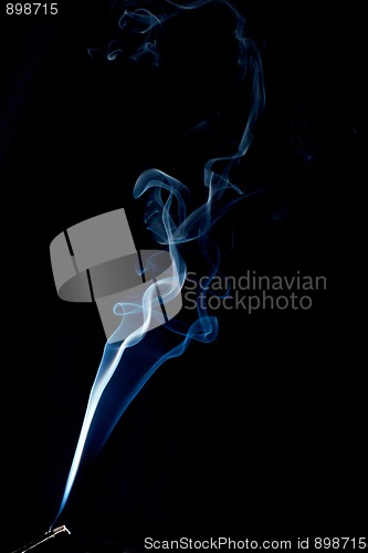 Image of spiraling smoke abstract on black