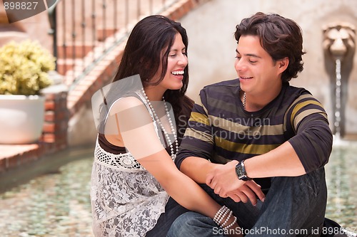 Image of Attractive Hispanic Couple At A Fountain