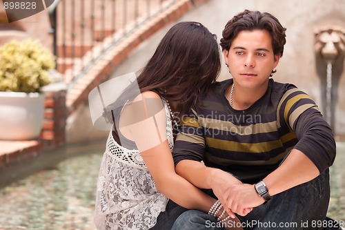 Image of Attractive Hispanic Couple During A Serious Moment