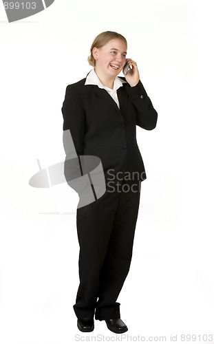 Image of young business woman on mobile phone 