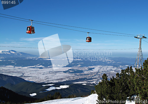 Image of Cable car ski lift over mountain landscape