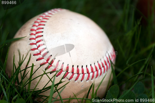 Image of Old Baseball in the Grass