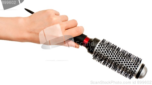 Image of Hand with hairbrush