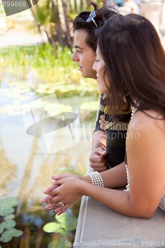 Image of Attractive Hispanic Couple Overlook Pond