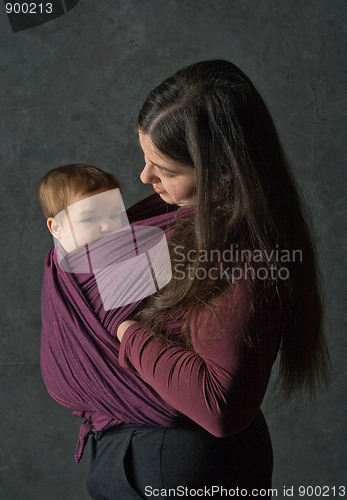 Image of Mother with her daughter in sling