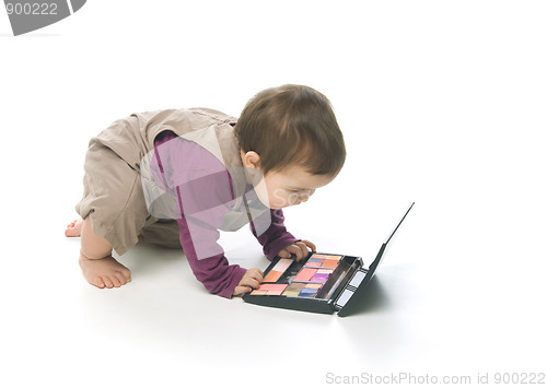 Image of Baby girl with a cosmetic box