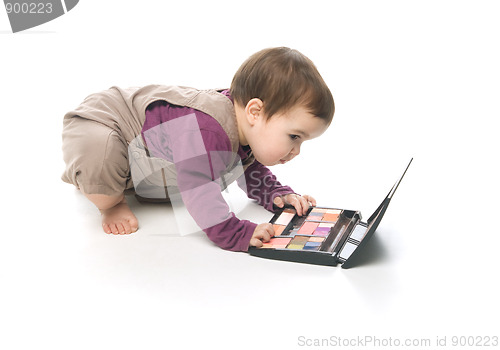 Image of Baby girl with a cosmetic box