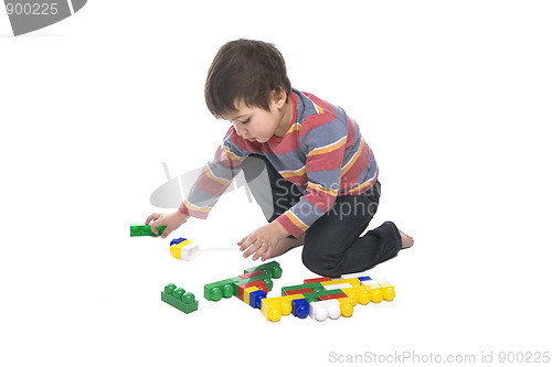 Image of Boy with multicolored bricks